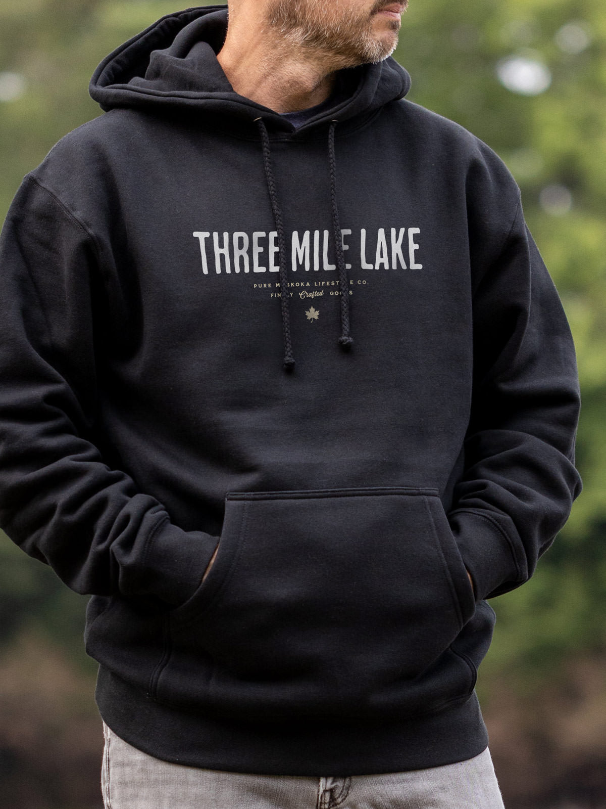 Three Mile Lake unisex hoodie in Black - Pure Muskoka - Male Model