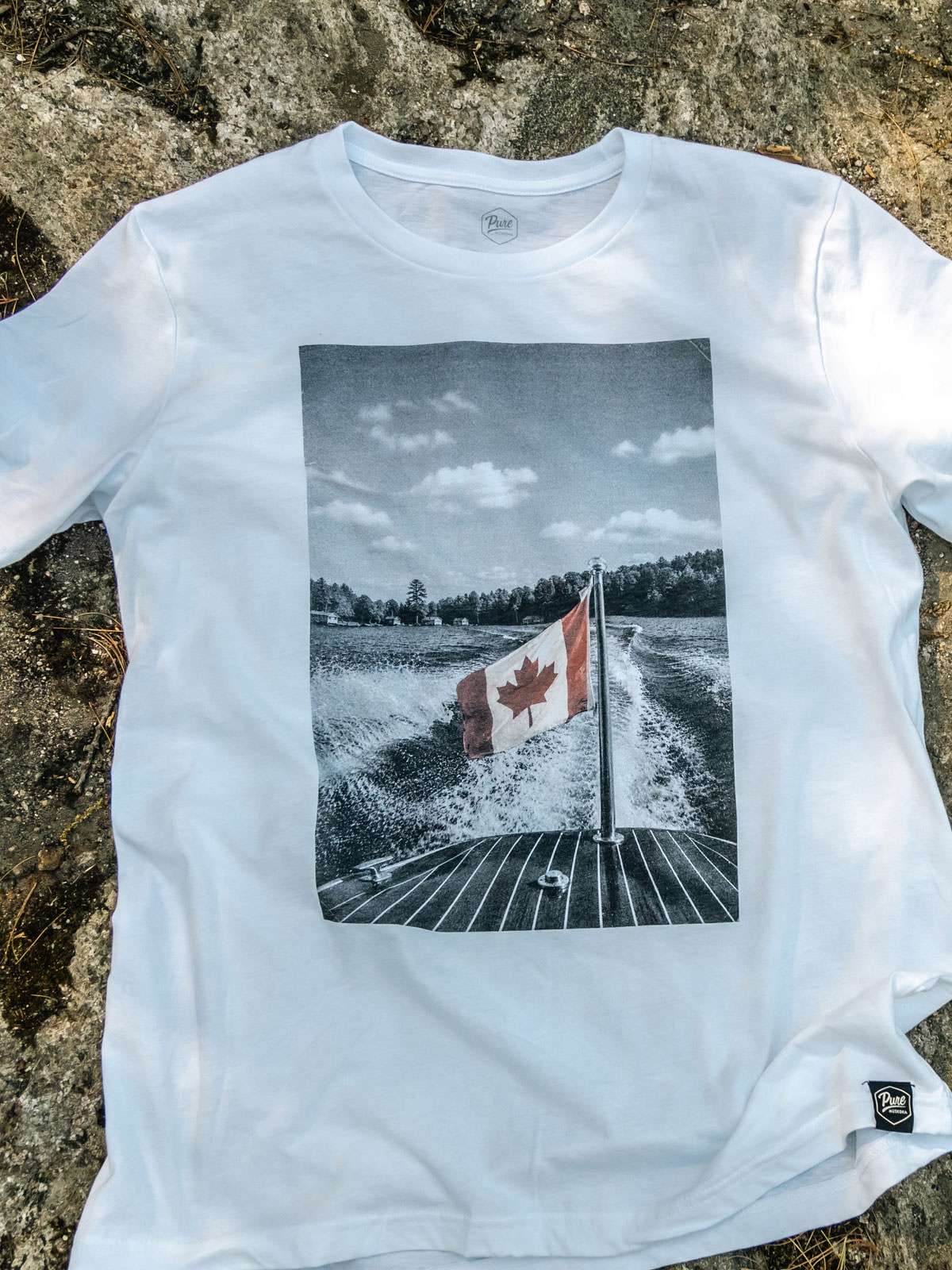 The Boat Flag - Canada Day T-Shirt - Flat Lay - Pure Muskoka