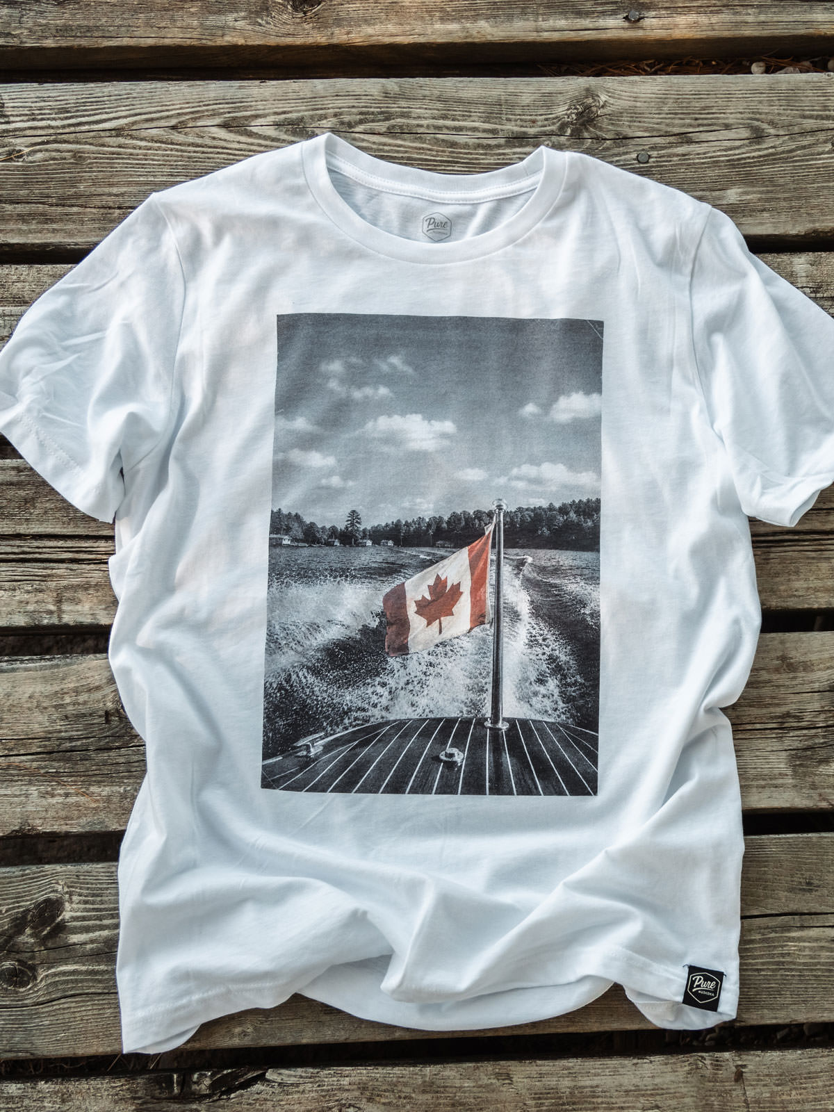 The Boat Flag - Canada Day T-Shirt - Flat Lay - Pure Muskoka