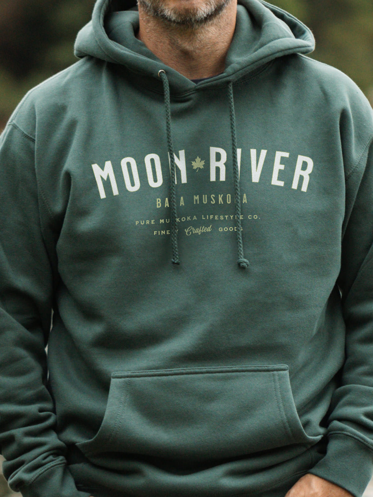 Moon River unisex hoodie in Alpine Green - Pure Muskoka - Male Model