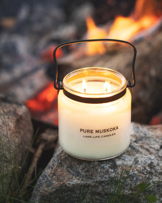Pure Muskoka Candle at the bonfire at the lake at dusk, Muskoka.